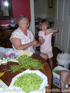Mom and Abigail doing beans