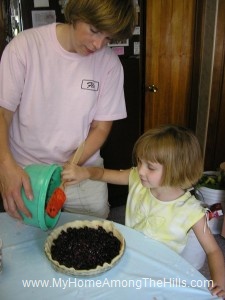 Putting berries in the pie shell