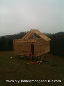 Half of the rafters done in our small cabin