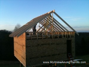 Most of the rafters in place on our small cabin in the woods