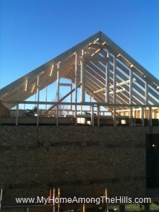 Big window framed into the gable of our small cabin