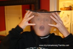 The boy wearing an Elizabethan collar
