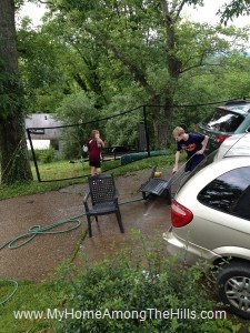 Kids washing the outdoor furniture