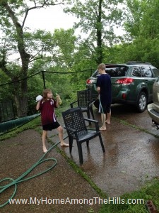 Kids washing the outdoor furniture