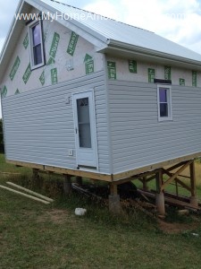Installing siding on the house