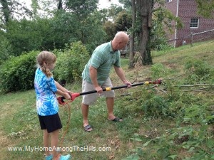 My daughter running the chainsaw!