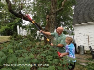 My daughter running the chainsaw