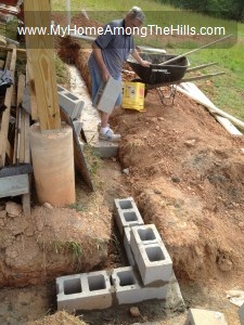 Grandpa laying concrete blocks