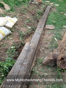 Raised bed garden with railroad ties